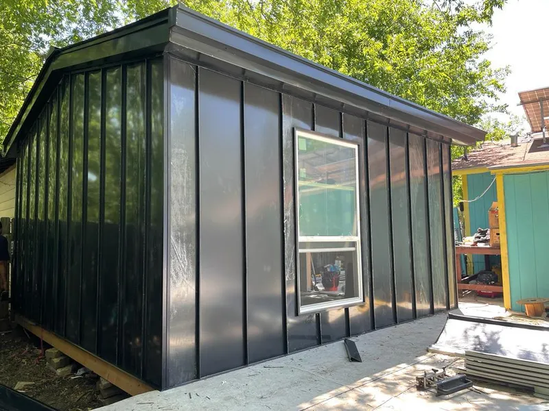 Black standing seam metal wall panels for Roof Inspection in San Diego Country Estates