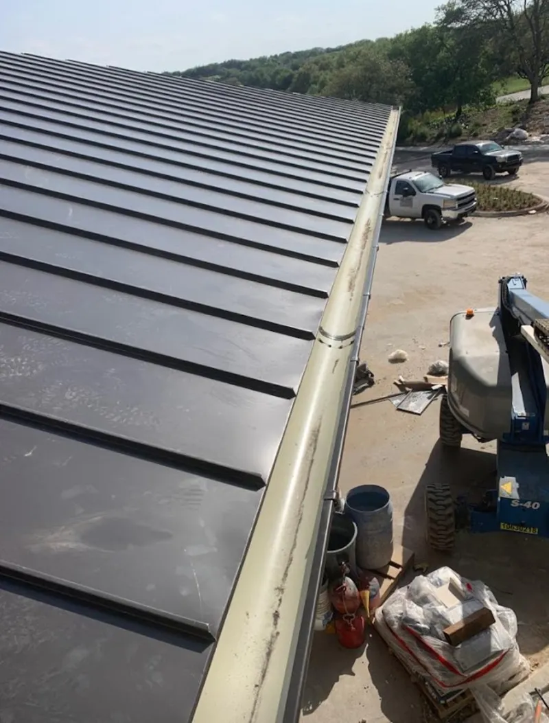 Standing seam panel and gutter detail on a metal roofing jobsite in San Diego Country Estates